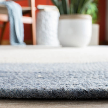 SAFAVIEH Braided Nazca Solid Bordered Area Rug, Ivory/Blue, 4' x 6' Oval