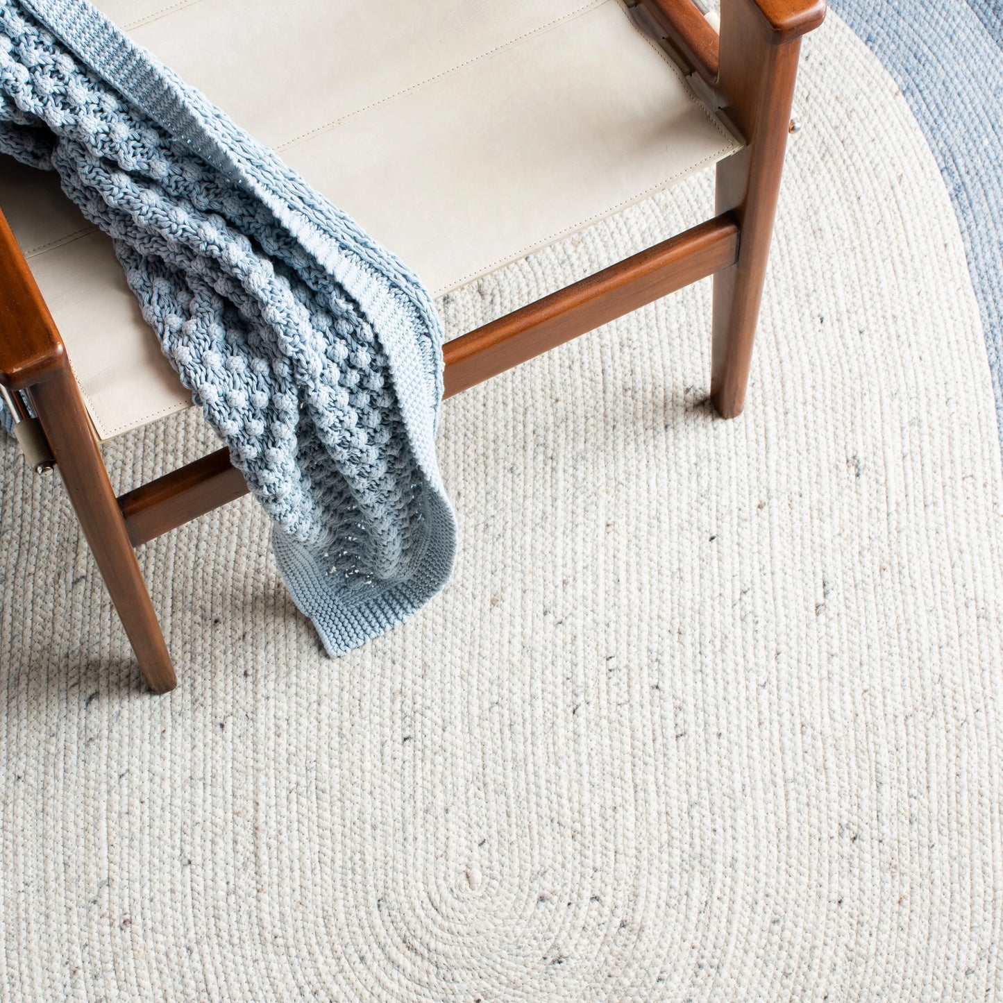 SAFAVIEH Braided Nazca Solid Bordered Area Rug, Ivory/Blue, 4' x 6' Oval