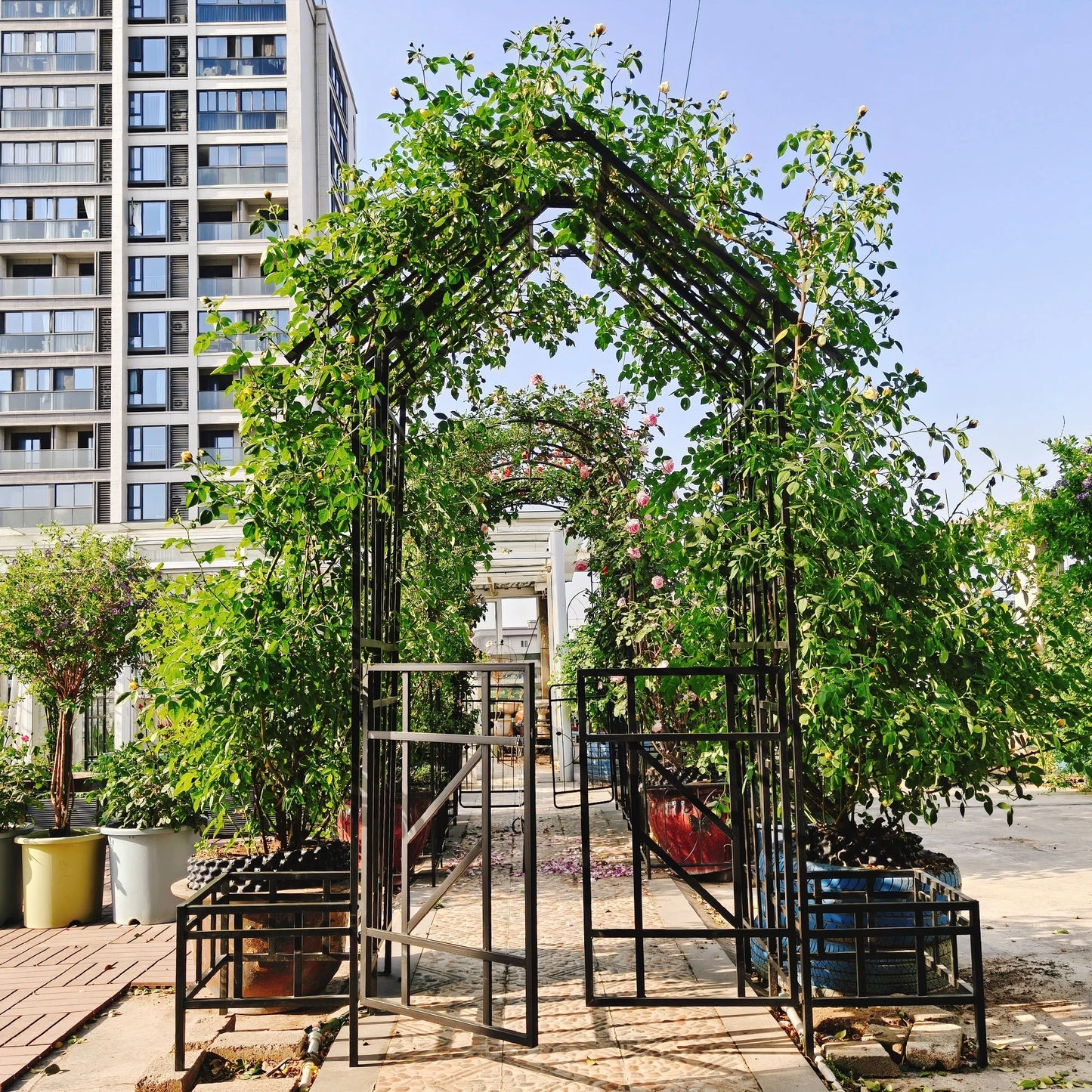 Yoneston 97.24" H Metal Garden Arbor with Gate and Planter, Garden Arch for Climbing Plants Support Rose Arch for Outdoor, Black